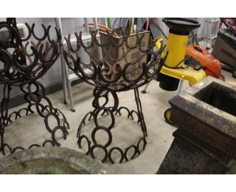 An architectural garden planter stand formed from horseshoes, width 66 cm, height 76 cm.