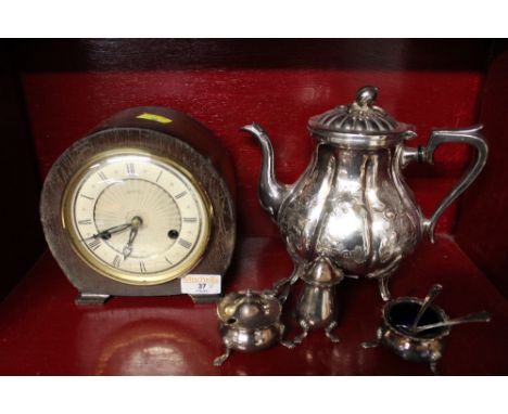 A vintage mantle clock, silver plated teapot and silver plated cruet set 