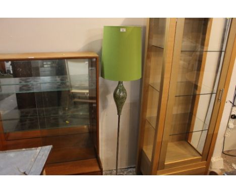 Modern floor lamp with bulbous decoration and green shade