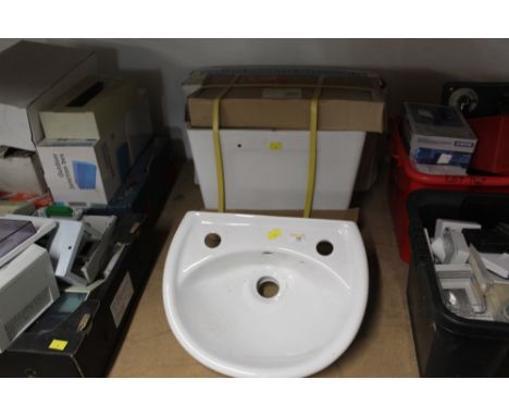 Two Slimline cisterns and small wash basin