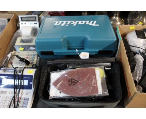 Cased Makita grinder and a Ryobi sander 