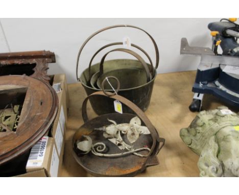 Three brass jam pans, a skillet and a light fitting
