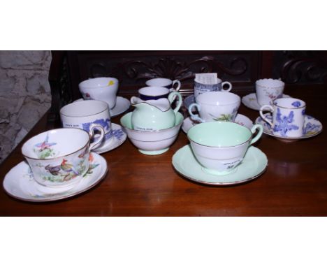 A collection of various English porcelain coffee cans and saucers, including Royal Worcester "Blue Dragon, other Royal Worces