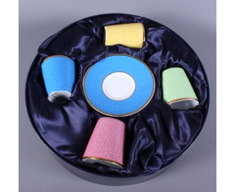 A boxed Royal Worcester porcelain Harlequin bone china coffee set, made to commemorate the 80th birthday of Queen Elizabeth