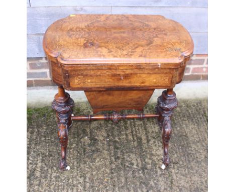 A Victorian figured walnut and line inlaid fold-over top gaming table, the interior with backgammon, cribbage and chessboard,