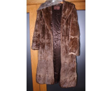 A lady's mid 20th century Marshall & Snelgrove of London three quarter length fur coat, a Lady's musquash three quarter lengt