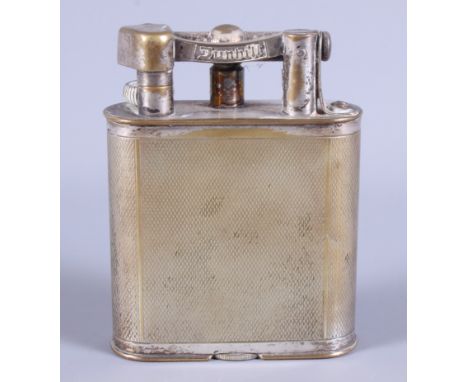 A Dunhill engine turned cigarette lighter, 4 1/2" high