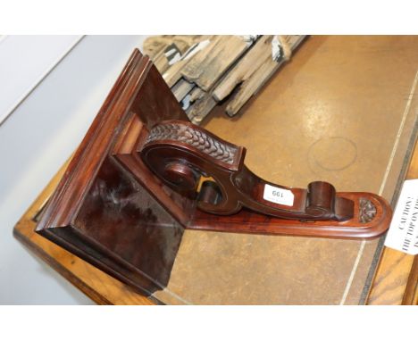 A mahogany wall bracket with scroll supporter, 11" wide