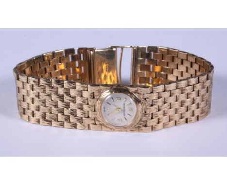 A lady's 9ct gold Jaeger-LeCoultre wristwatch, serial no 5208, back winding manual movement, white enamel dial with baton and
