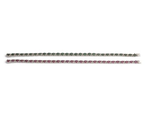 A ruby and diamond line bracelet and a matching emerald braceleteach set with oval rubies or emeralds with diamond point deta