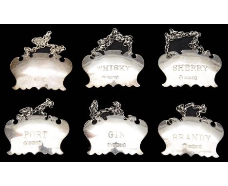 A set of six modern silver decanter labelsSheffield, 1977, silver jubilee mark, by Francis Howard Ltdof plain shaped design e