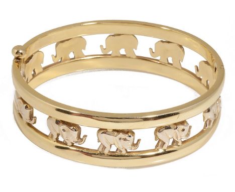 A contemporary Continental hinged gold elephant banglethe 14ct yellow gold pierced bangle formed as a continual row of marchi