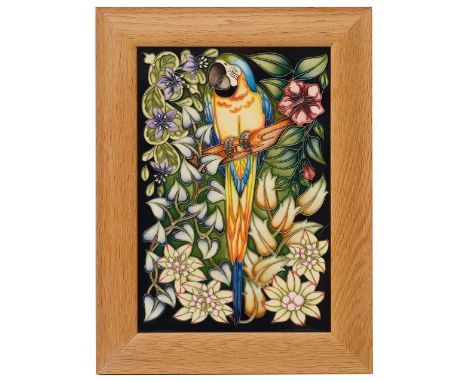 A Moorcroft 'Ararauna' plaque by Sian Leeper2004, of rectangular form with tube lined decoration, framed in light oak, painte
