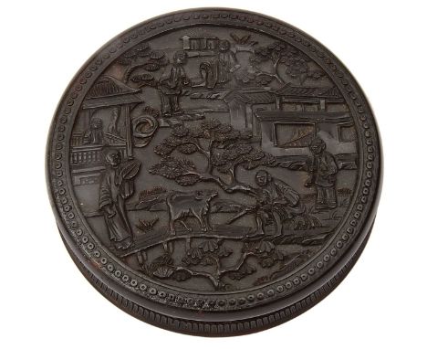 A 19th century Chinese Canton tortoiseshell circular snuff box and coverrelief carved with figural garden landscapes to both 