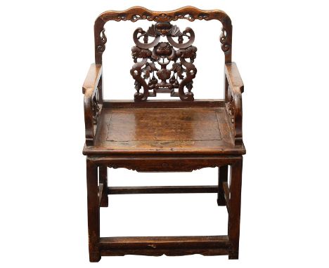 A 19th century Chinese carved hardwood open armchairhaving shaped scroll carved crest rail and pierced back splat carved with