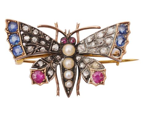 An attractive Victorian diamond and gem set butterfly broochhaving sapphire and ruby tipped rose diamond set wings, ruby eyes