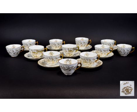 Coalport Acid Gold Bone China Collection Comprises twenty one  pieces to include 12 cups and 9 saucers, white ground with gol