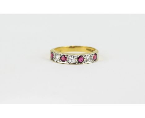 Ruby and Diamond Half Eternity Ring, comprising four round cut rubies interspaced with three similar diamonds, all set in a s