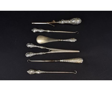 Victorian and Edwardian Period Collection of Very Ornate Embossed Silver Handle Glove Stretchers (rare) lever mechanism glove