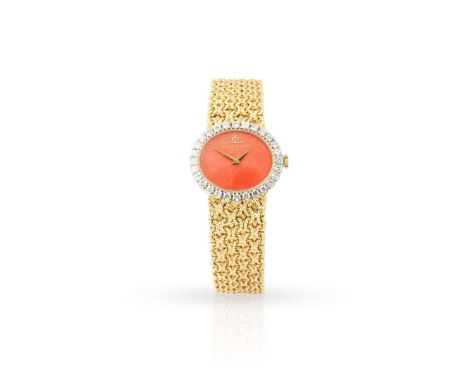  Baume & Mercier. A Ladies attractive 18k yellow gold and diamond-set mechanical bracelet watch with coral dial, Ref.38310T, 