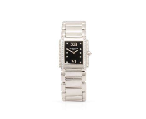 Patek Philippe. A Ladies very fine and attractive 18k white gold and diamond-set quartz bracelet watch, Twenty~4, Ref.4910/2