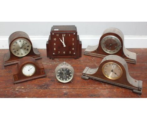 An early 20th century square-faced clock with stepped sides by Ansonia Clock Co New York, together with four  various mantel 