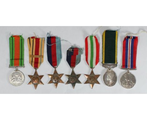 A collection of assorted medals comprising a British Army Territorial Efficiency Medal (George VI) named to '6204881 .GNR. A 