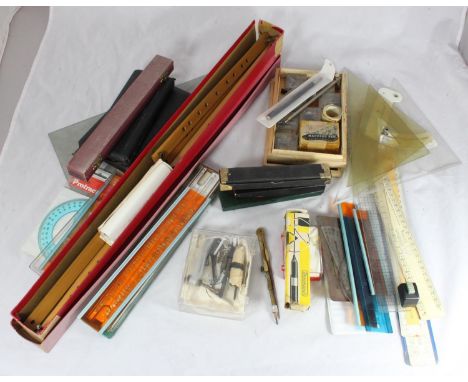 A quantity of technical drawing instruments including a Harling pantograph and an Uno stencil set etc. 