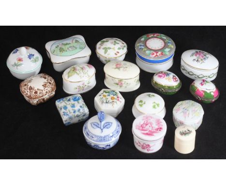 A collection of 17 assorted ceramic pill boxes, one boxed, the rest loose, predominantly with floral decoration, including ex