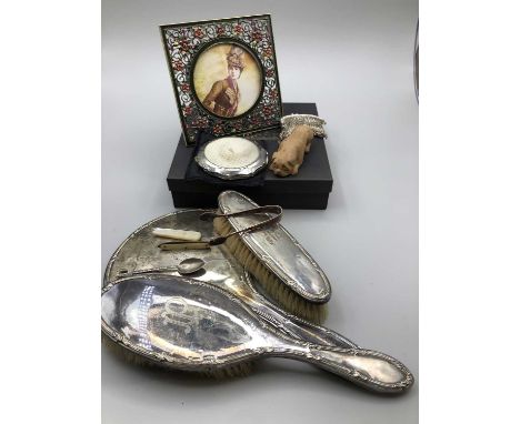 A hallmarked silver-backed three-part dressing table set, an 850 stamped silver fork, Stratton compact, vintage style photo f