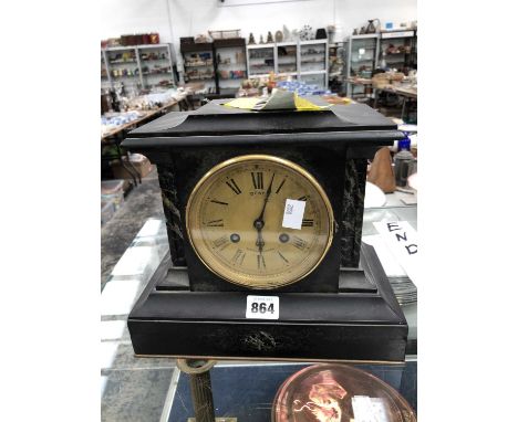 A black slate mantel clock retailed by Dent, the Brocot movement striking on a coiled rod