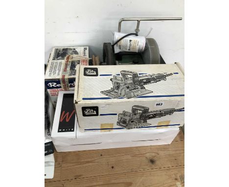 An Elu biscuit cutter, A tormek grinder, A rRecord vice and  A " sabre saw"