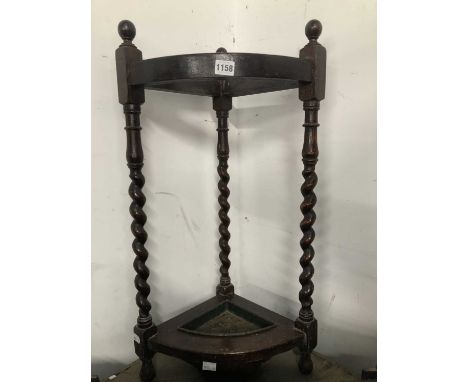 An oak corner stick stand.
