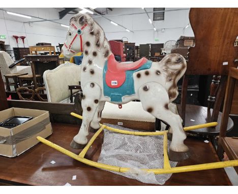 A vintage Tri-ang rocking horse.