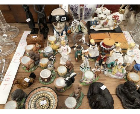 A collection of Forest Friends egg cups, various figurines, three Chinese building form music boxes, Hereford China and other