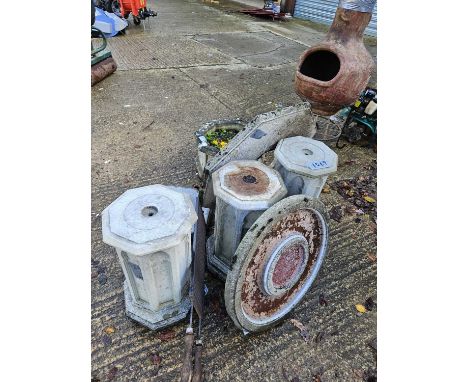 Three concrete pedestals and a matching planter