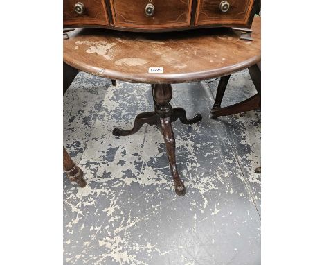 A 19th-century tripod table.