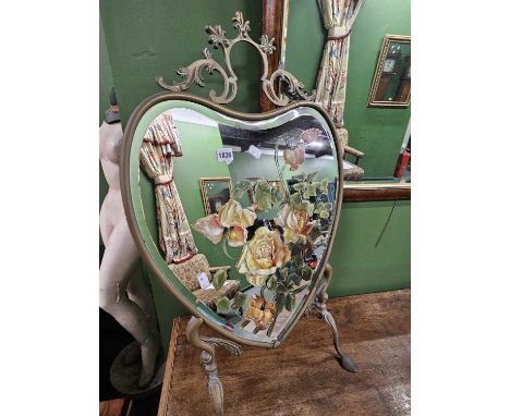 An Edwardian mirrored firescreen.