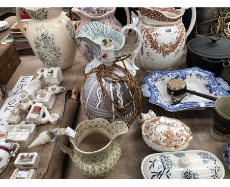 Four wash jugs, studio pottery, a Le Creuset lidded cooking pot, a wooden doll, Goss type armorial porcelains, etc.