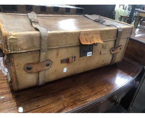 A vintage leather cabin trunk.