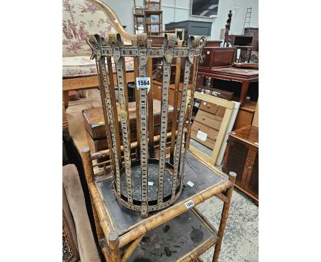 A metal stick stand. H 52 W 31 D 31cms