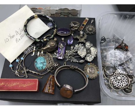 A collection of silver and other jewellery including an amber bangle and pendant, an antique stick pin, Vintage Yves St. Laur