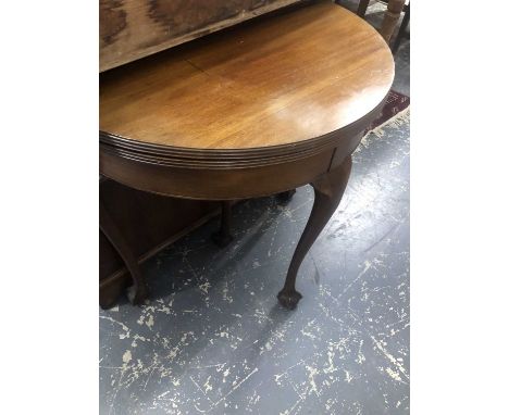 A demi-lune foldover card table.