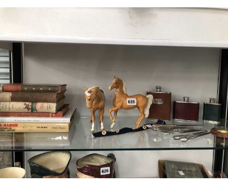 A royal doulton horse figure and a Beswick example together with a set of four fox mask print buttons, hip flasks, hallmarked