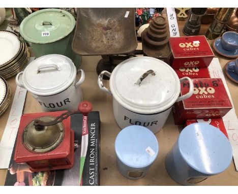 Ename storage vessels, two named Flour, Oxo cube tins, a coffee grinder, a mincer and a set of scales with weights