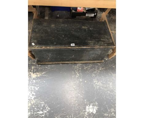 A wooden tool chest containing some tools