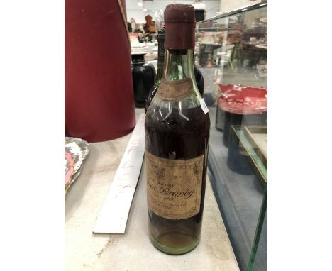 Four bottles of red wine, mainly 1960's- 70's together with a bottle cognac