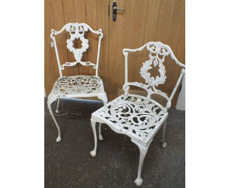 TWO PAINTED WHITE CAST GARDEN CHAIRS