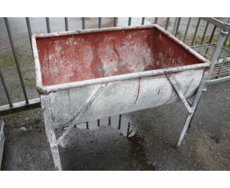 A GALVANIZED TROUGH ON STAND 