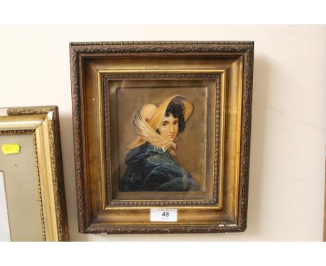 A FRAMED AND GLAZED OIL ON CARD PORTRAIT OF A YOUNG WOMAN IN A BONNET